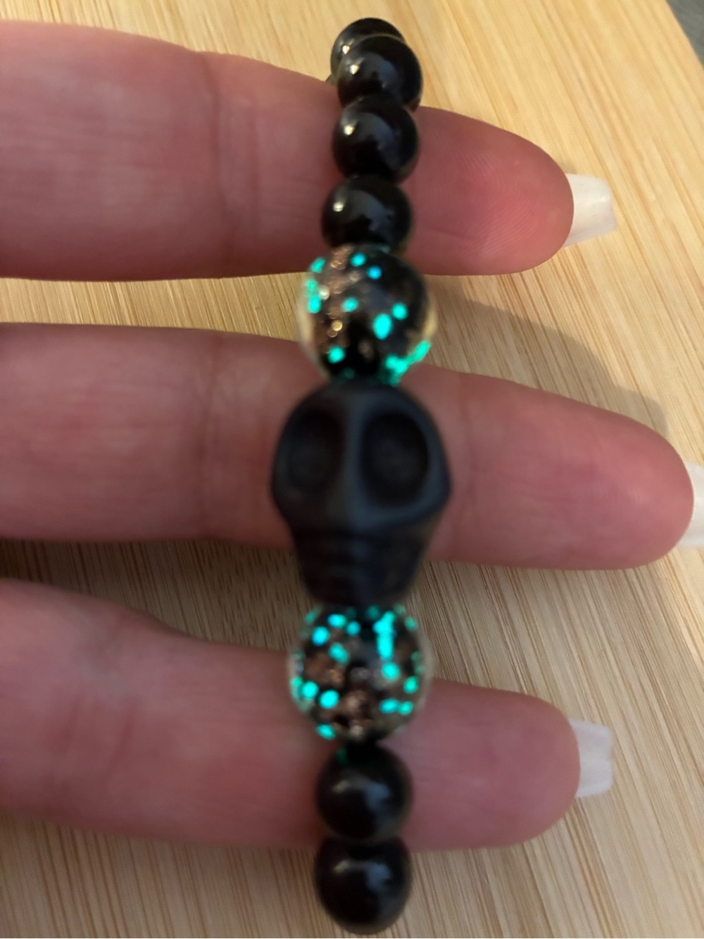 Black onyx stretchy skull beaded bracelet with glow accent glass lamp work beads